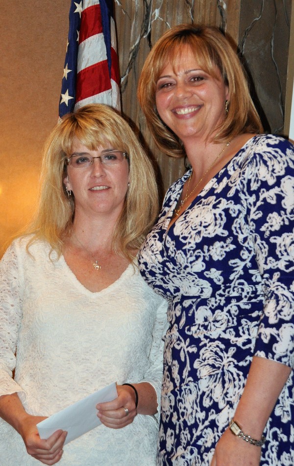 In April, Jennifer Kauffman (r), chapter president, recognizes Jen Jones, chapter treasurer, from Praxis Engineering, for her years of service in her role.